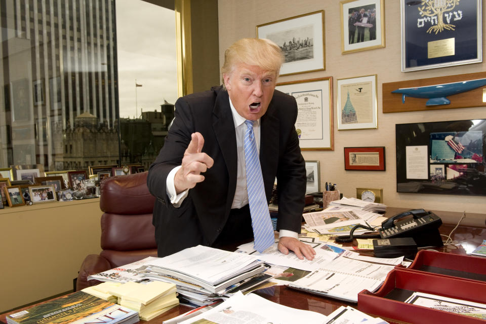 Donald Trump poses for photographs in his Trump Tower office on June 13, 2012, in New York.  (Photo by Diane Bondareff/Invision/AP) 