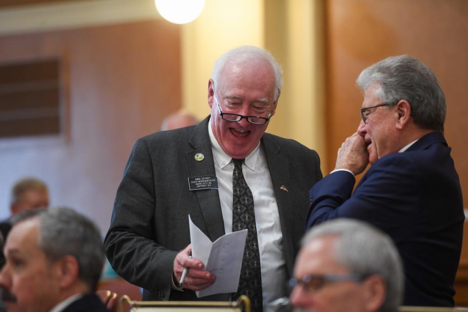 State representative Mike Derby laughs with another legislator after the State of the State address on Tuesday, January 9, 2024 at South Dakota State Captiol in Pierre.