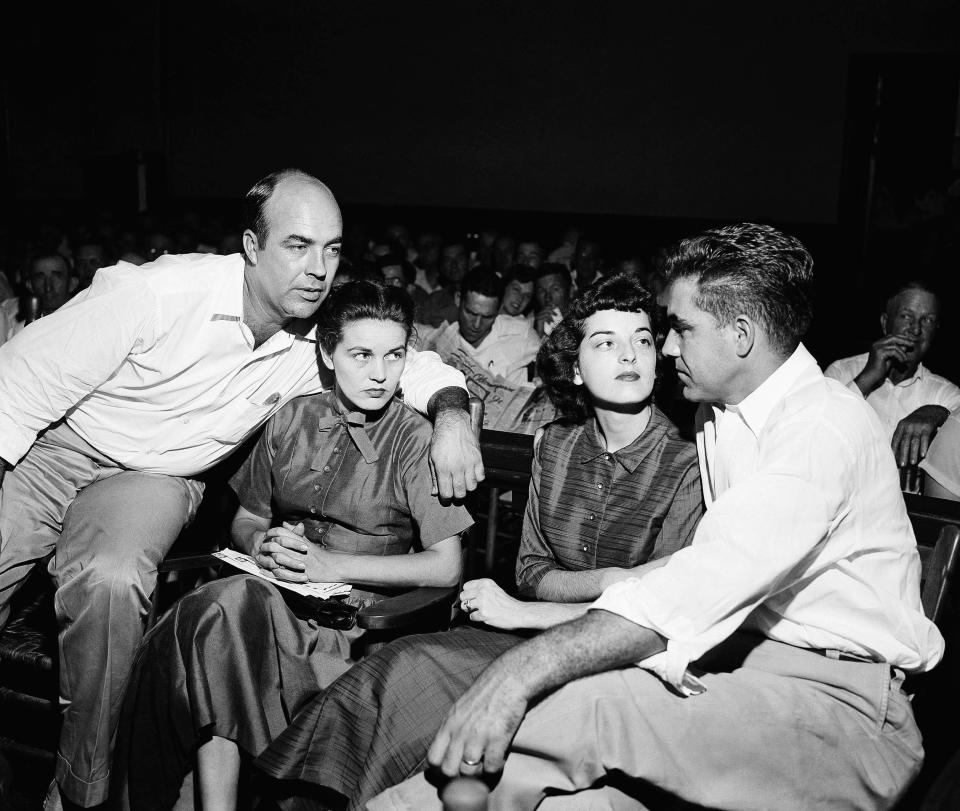 J.W. Milam, left, and Roy Bryant, right, sit with their wives in a courtroom in 1955. Milam and Bryant were acquitted in the murder of Emmett Till.
FILE - In this Sept. 23, 1955, file photo. J.W. Milam, left, and Roy Bryant, right, sit with their wives in a courtroom in Sumner, Mo. Milam and Bryant were acquitted of murder in the slaying of Emmett Till. Wheeler Parker and Deborah Watts, cousins of Till, said authorities should take a fresh look at the killing of Till since Carolyn Donham, then wife of Roy Bryant, who was at the center of the case, is now quoted as saying she lied in a new book.