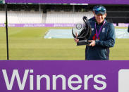 FILE PHOTO: Cricket - Fifth One Day International - England v Pakistan - Emerald Headingley, Headingley, Britain - May 19, 2019 England's Eoin Morgan celebrates winning the match as he poses with the trophy Action Images via Reuters/Andrew Boyers/File Photo