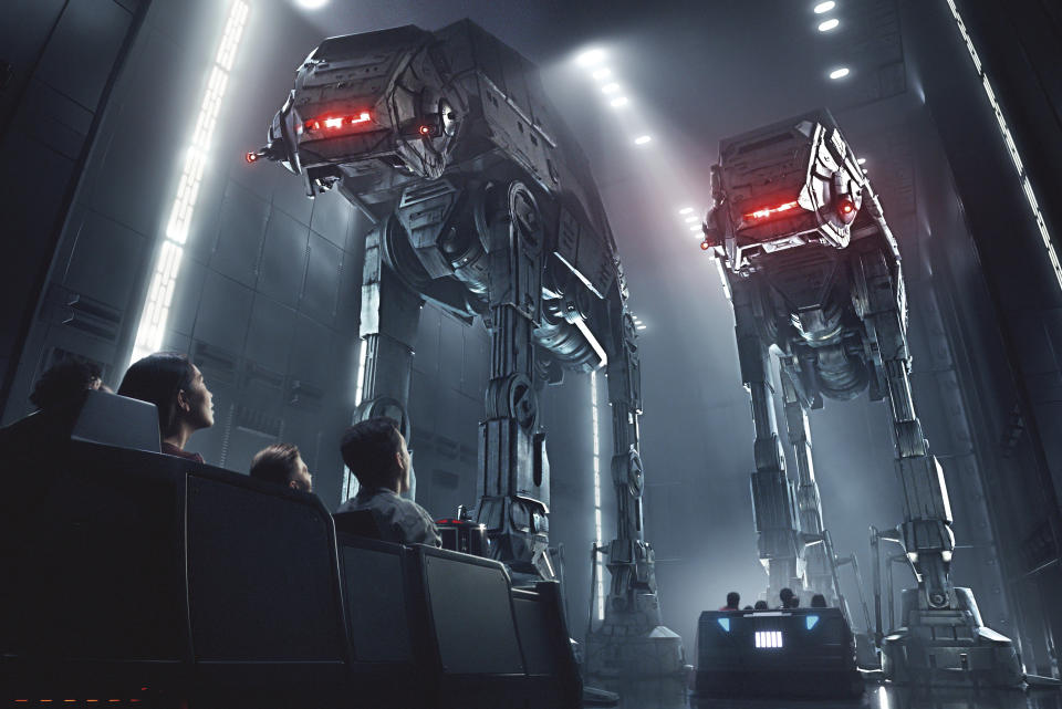 This rendering released by Disney and Lucasfilm shows people on the planned Star Wars: Rise of the Resistance attraction, part of Star Wars: Galaxy's Edge. The 14-acre area set to open this summer at the Disneyland Resort in Anaheim, California, then in the fall at Disney's Hollywood Studios in Orlando, Florida. (Disney Parks/Lucasfilm via AP)