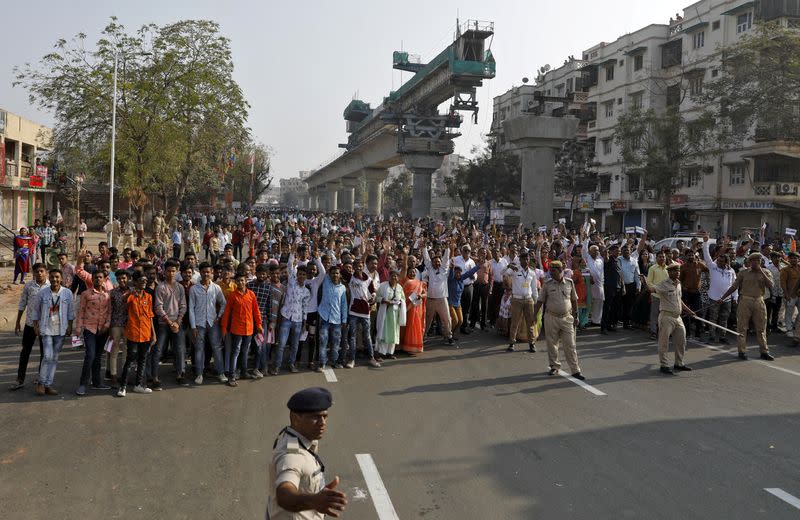 People arrive at the Sardar Patel Stadium where U.S. President Trump will address a "Namaste Trump" event with Indian Prime Minister Modi in Ahmedabad