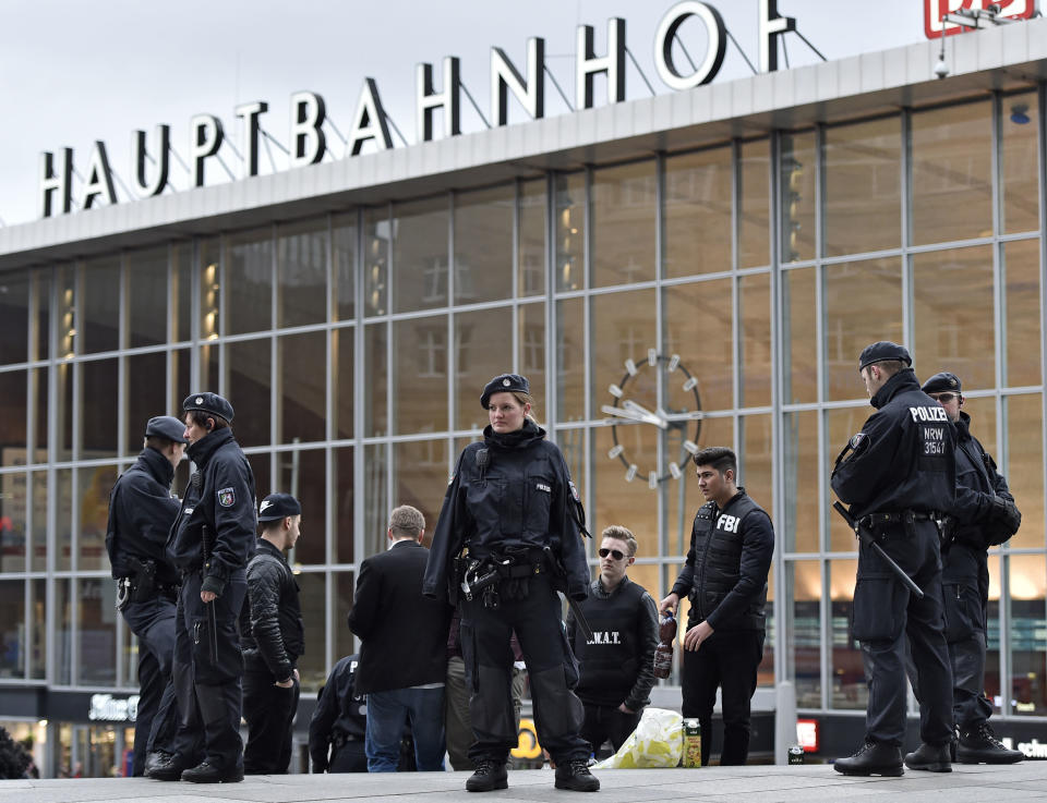 FILE - In this Feb. 4, 2016 file photo police patrols in front of the main station during the start of the street carnival in Cologne, Germany. Cologne police say they have closed parts of the western German city's main train station because of a hostage situation. The incident appears to have started Monday at a pharmacy inside the train station. ( AP Photo/Martin Meissner, file)