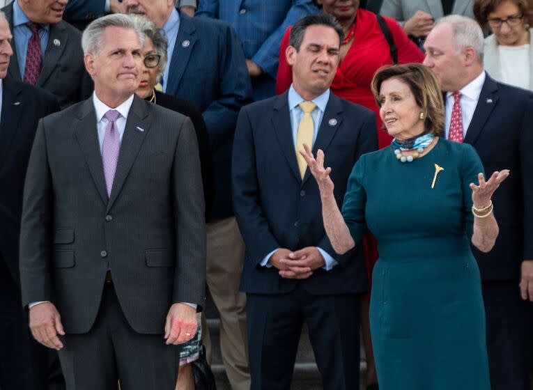 US Speaker of the House Nancy Pelosi (D-CA) (R) speaks with US Representative Kevin McCarthy (R-CA) (L).