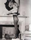 <p>Marilyn Monroe poses in stockings next to a festive fireplace after being <a href="https://books.google.com/books?id=M2M-DwAAQBAJ&pg=PT51&lpg=PT51&dq=marilyn+monroe+the+Present+all+GI%27s+would+like+to+find+in+their+Christmas+stocking&source=bl&ots=Kcb96VE854&sig=ACfU3U3mMYXJ7PstQqN9fDRRwlj91MuXzg&hl=en&sa=X&ved=2ahUKEwinw7mFrZrmAhVkneAKHfD2DooQ6AEwEHoECAkQAQ#v=onepage&q=marilyn%20monroe%20the%20Present%20all%20GI's%20would%20like%20to%20find%20in%20their%20Christmas%20stocking&f=false" rel="nofollow noopener" target="_blank" data-ylk="slk:voted;elm:context_link;itc:0;sec:content-canvas" class="link ">voted</a>, "the present all GI's would like to find in their Christmas stocking." Clever!</p>