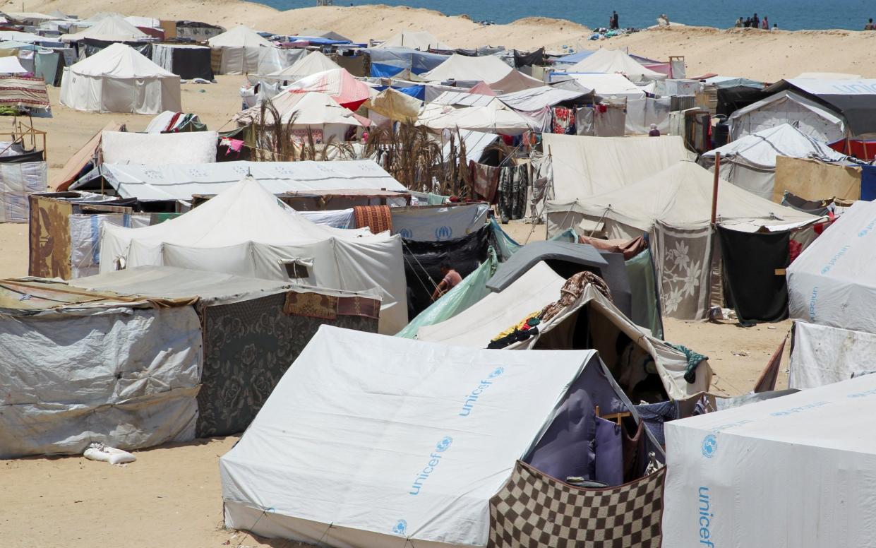 Displaced Palestinians shelter at a camp in the Al-Mawasi area of Rafah, in southern Gaza