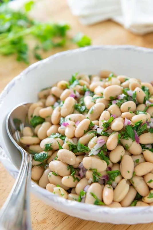 <p>Fifteen Spatulas</p><p>This healthy white bean salad recipe is as simple as mixing a handful of ingredients together, and letting the flavors meld. It’s a great recipe for meal prep!</p><p><strong>Get the recipe: <a href="https://www.fifteenspatulas.com/herb-lemon-white-bean-salad/" rel="nofollow noopener" target="_blank" data-ylk="slk:White Bean Salad;elm:context_link;itc:0;sec:content-canvas" class="link "><em>White Bean Salad</em></a></strong></p>