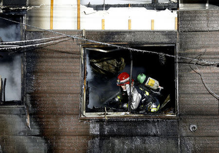 A firefighter inspects a facility to support senior people on welfare, where a fire occurred, in Sapporo, Japan, in this photo taken by Kyodo on February 1, 2018. Mandatory credit Kyodo/via REUTERS