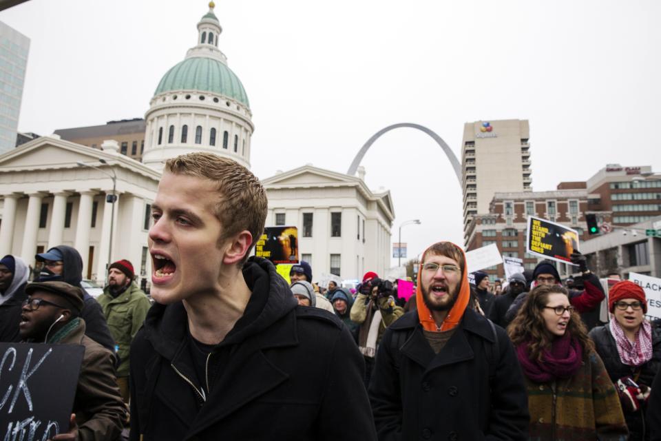 Demonstrators march to City Hall as they protest a grand jury's decision not to indict white police officer Darren Wilson for killing unarmed black teenager Michael Brown, in St. Louis, Missouri November 26, 2014. (REUTERS/Lucas Jackson)