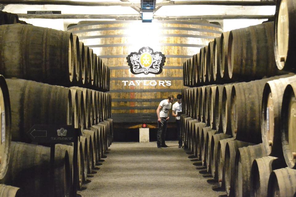 This Feb. 21, 2017 photo shows the warehouse in Vila Nova de Gaia, Portugal, where Taylor ages ports in oak barrels. The 10-euro entry fee includes a three-wine tasting and a self-guided audio tour. (Albert Stumm via AP)