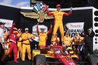 Alex Palou, of Spain, celebrates after winning the IndyCar Grand Prix auto race at Indianapolis Motor Speedway, Saturday, May 11, 2024, in Indianapolis. (AP Photo/Darron Cummings)