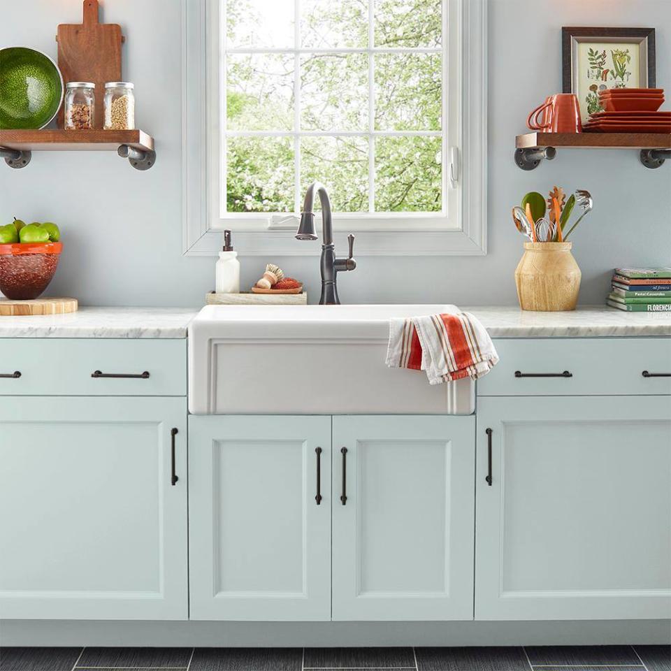 Kitchen cabinets painted in Calm by Behr.