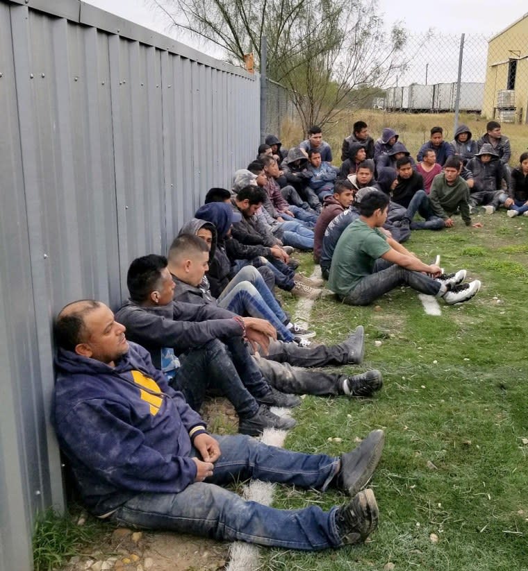 The bottom container concealed 36 illegal immigrants and was resting on top of the plywood which was a mixture of sand, dirt, and gravel.