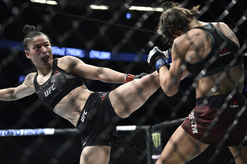 LAS VEGAS, NEVADA - MARCH 07: (L-R) Zhang Weili of China kicks Joanna Jedrzejczyk of Poland in their UFC strawweight championship fight during the UFC 248 event at T-Mobile Arena on March 07, 2020 in Las Vegas, Nevada. (Photo by Chris Unger/Zuffa LLC)