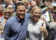 FILE - In this June 5, 2010 file photo, former Massachusetts Gov. Mitt Romney stands with Meg Whitman, then a candidate for the Republican nomination for Californian Gov., in Fullerton, Calif. When Republican presidential candidate Mitt Romney picks his running mate, odds are he’ll select someone with far less wealth than his own. Unless he chooses Hewlett-Packard CEO Meg Whitman, one of the richest women in America. Some of the potential Republican vice presidential nominees are grappling with the same financial issues as many of their countrymen. (AP Photo/Chris Carlson, File)