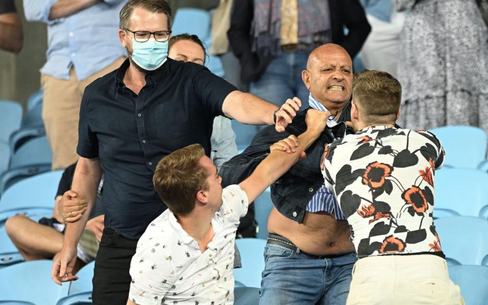 Fan ejected and fight breaks out in Melbourne as anti-mask furore overshadows day one at Australian Open - GETTY IMAGES