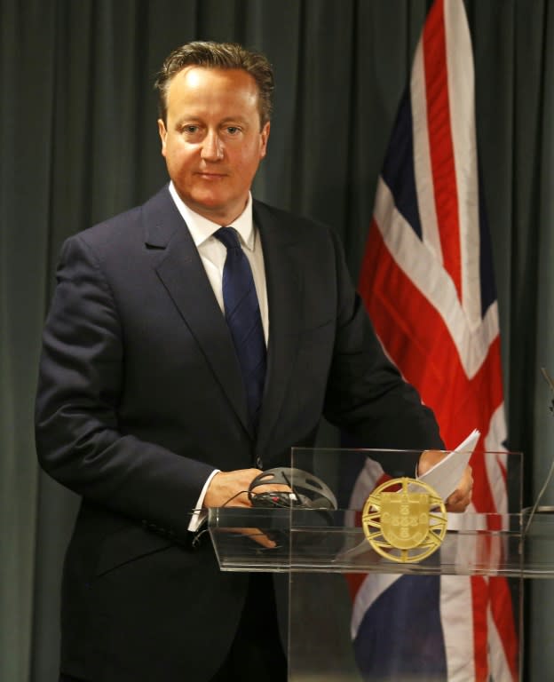 British Prime Minister David Cameron speaks to reporters at the St. Bento Palace in Lisbon on September 4, 2015