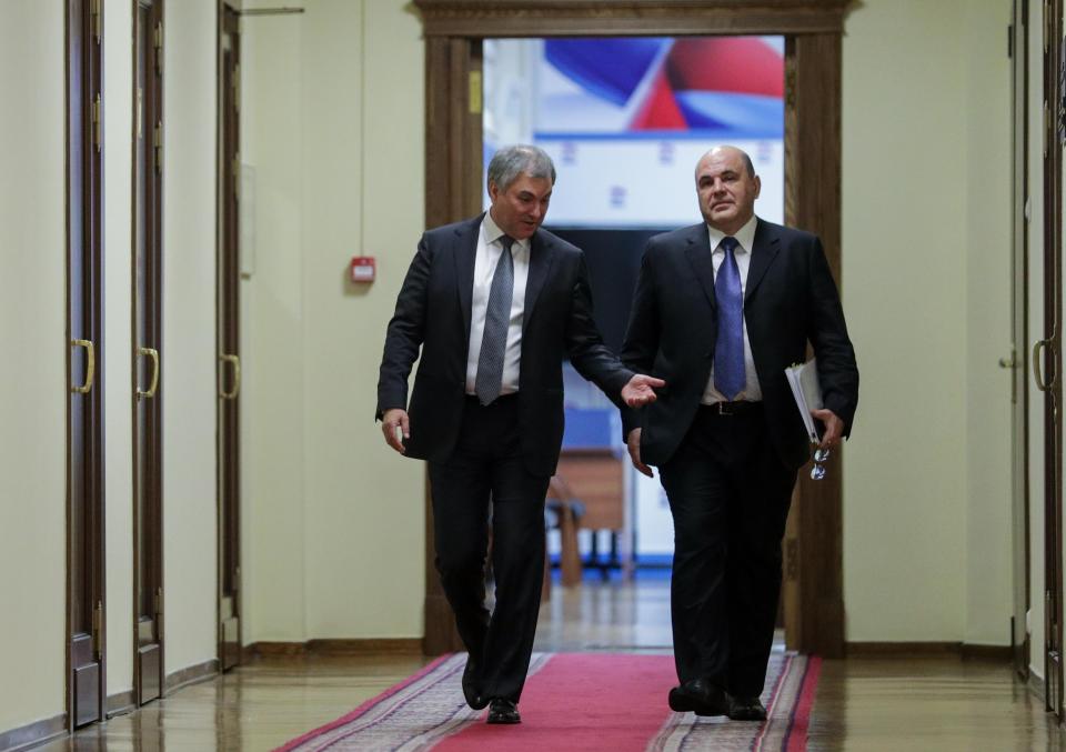 In this photo provided by The State Duma, The Federal Assembly of The Russian Federation, Russian State Duma speaker Vyacheslav Volodin, left, and Russian Tax Service chief Mikhail Mishustin, who was nominated to replace Medvedev, walk in the State Duma, the Lower House of the Russian Parliament in Moscow, Russia, Thursday, Jan. 16, 2020. Russian President Vladimir Putin has named tax service chief Mikhail Mishustin as Russia's new prime minister. (The State Duma, The Federal Assembly of The Russian Federation via AP)