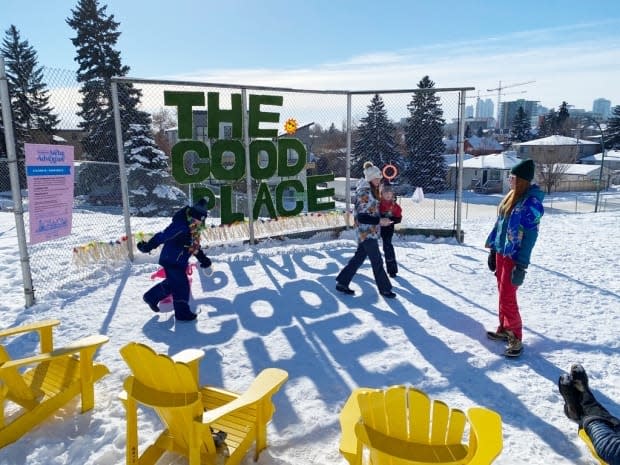 A team explores the Arctic Adventure's snow beach, which is equipped with deck chairs, a flamingo toss and 'chicken darts,' which involves throwing a rubber chicken into a target. (Submitted by the Bridgeland-Riverside Community Association - image credit)