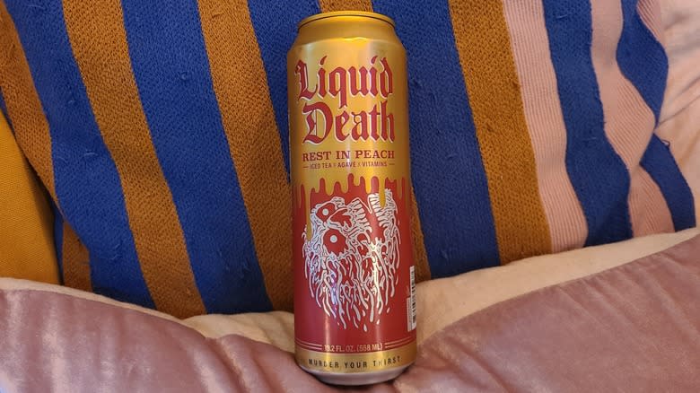 can of liquid death rest in peach