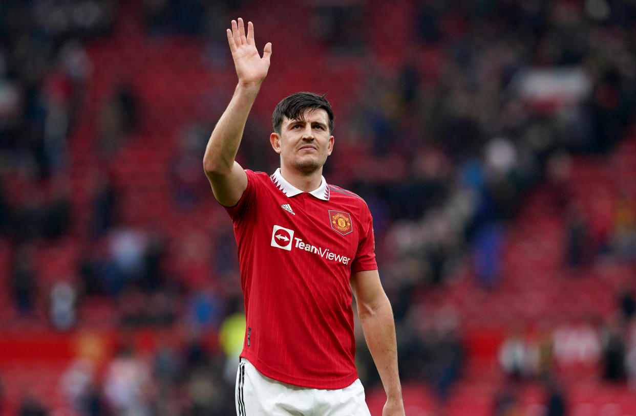 Manchester United's Harry Maguire acknowledges fans at Old Trafford.