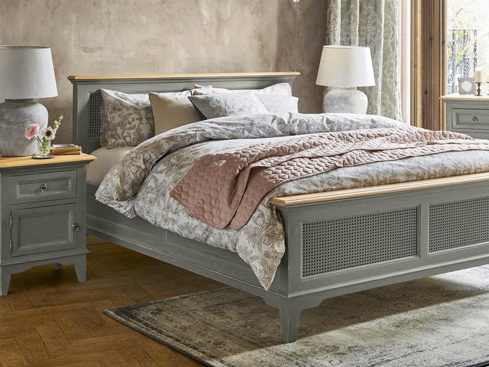 Bedroom with patterned sheets and country style