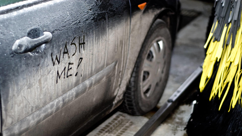 Interior of automatic car wash with dirty car (wash me sign) - Image.