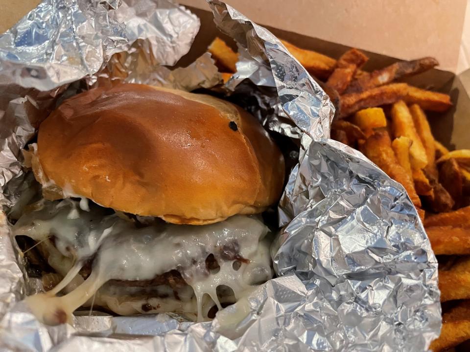 Smash Knoxville's Truffle Smash Burger features two patties topped with provolone cheese, grilled onions and mushrooms, and truffle mayo.