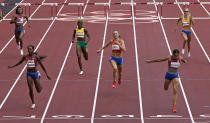 Sydney Mclaughlin, of United States wins the gold medal in the final of the the women's 400-meter hurdles ahead of Dalilah Muhammad, of United States, silver, and Femke Bol, of Netherlands, bronze, at the 2020 Summer Olympics, Wednesday, Aug. 4, 2021, in Tokyo, Japan. (AP Photo/Charlie Riedel)