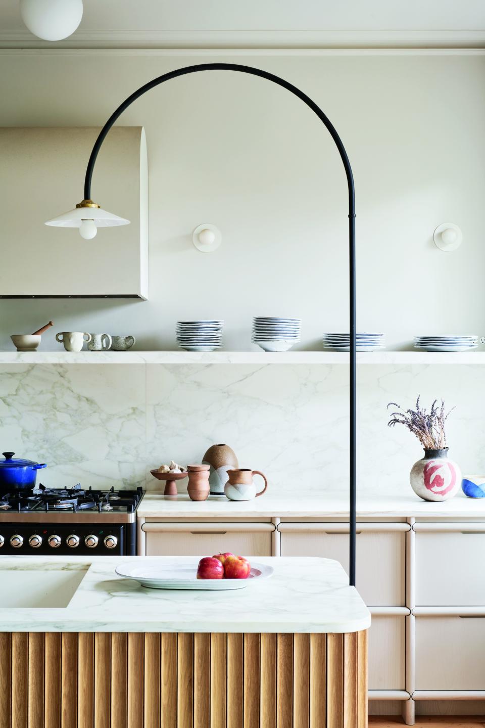 A kitchen designed by Brooklyn, New York’s Shapeless Studio that showcases a carefully curated assortment of ceramics.