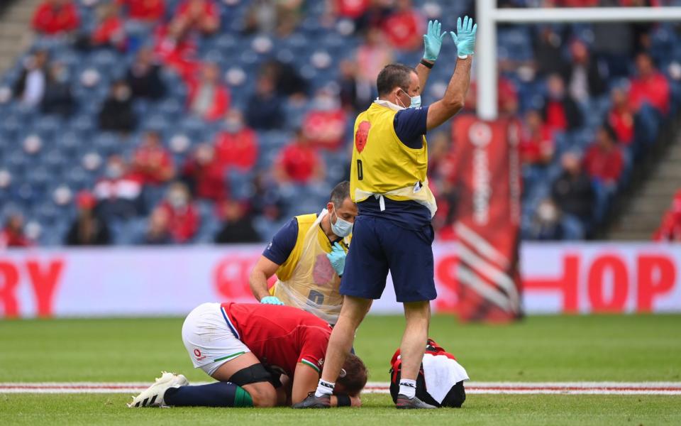  Lions captain Alun Wyn Jones is led from the field by medics - GETTY IMAGES