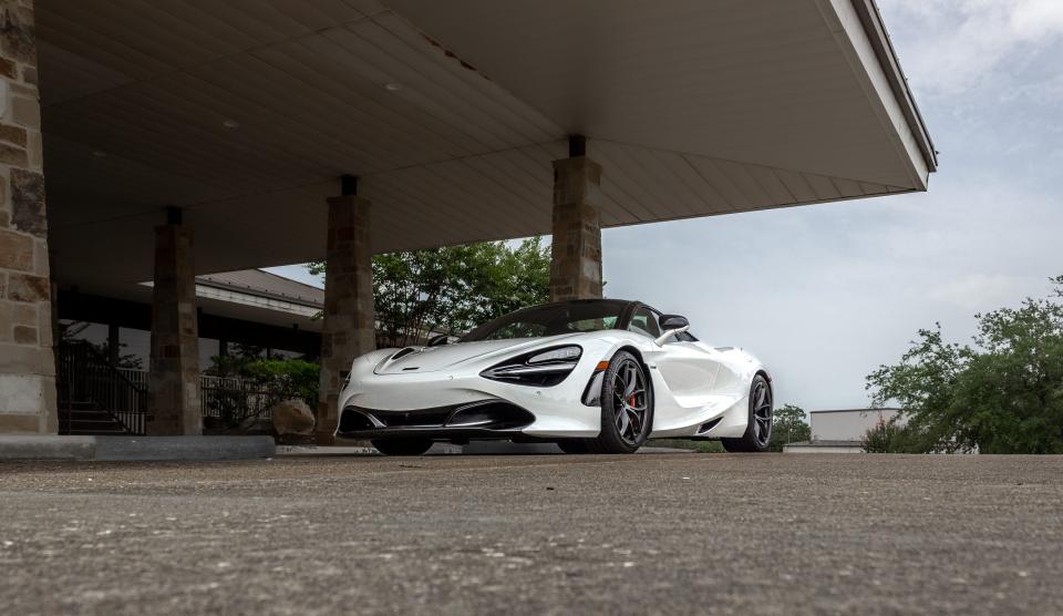 The McLaren 720S Spider under a dark awning.