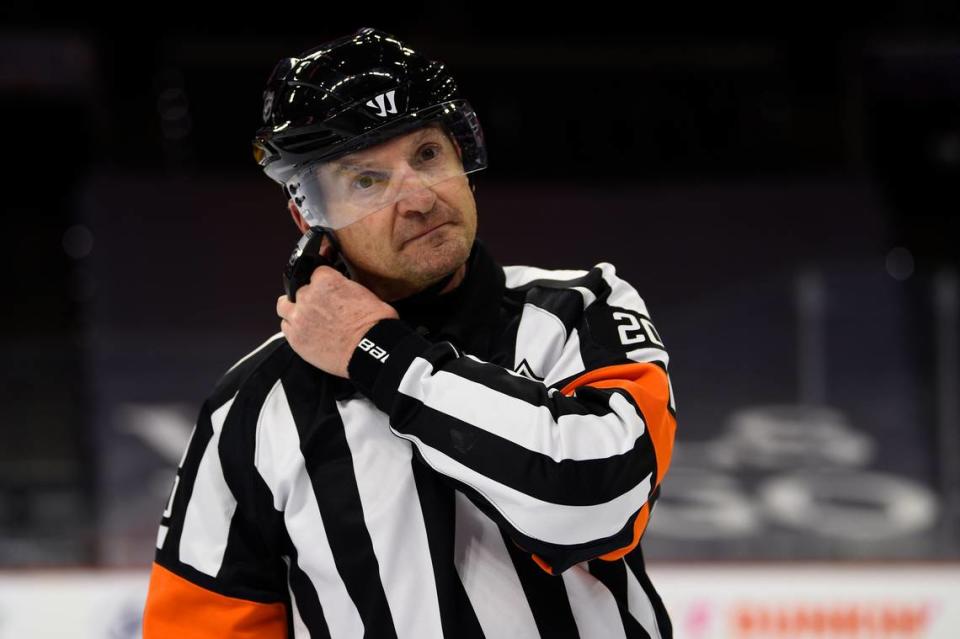 Referee Tim Peel is shown during an NHL hockey game between the Philadelphia Flyers and the New York Islanders in this Saturday, Jan. 30, 2021, file photo. Tim Peel’s career as an NHL referee is over after his voice was picked up by a TV microphone saying he wanted to call a penalty against the Nashville Predators. .(AP Photo/Derik Hamilton, File)