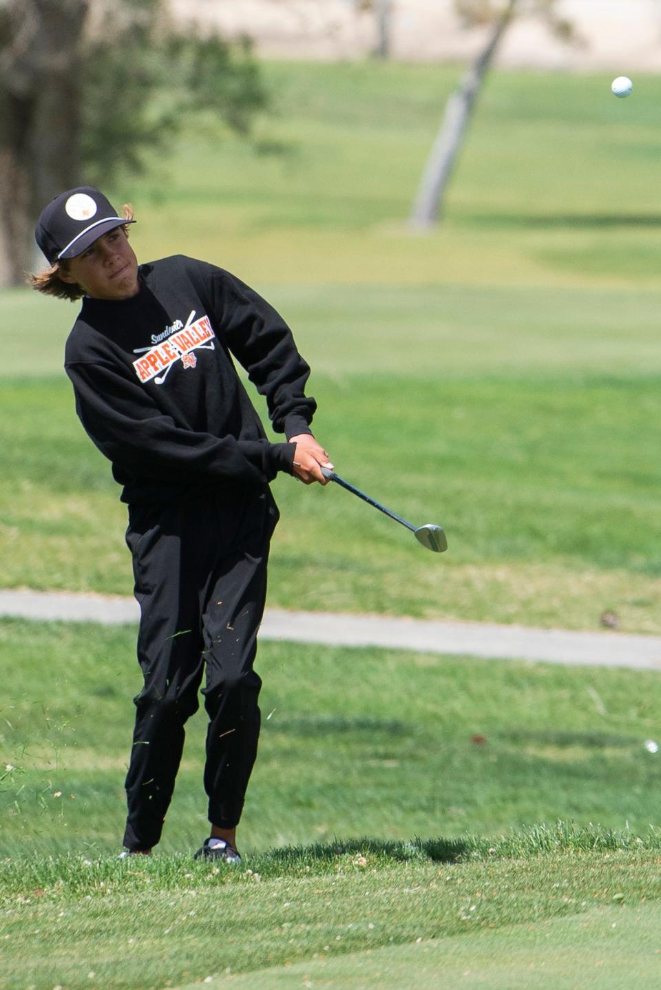 Apple Valley’s Brody Earnest chips a shot during the Mojave River League Finals at Apple Valley Golf Course on Tuesday, May 2, 2023.