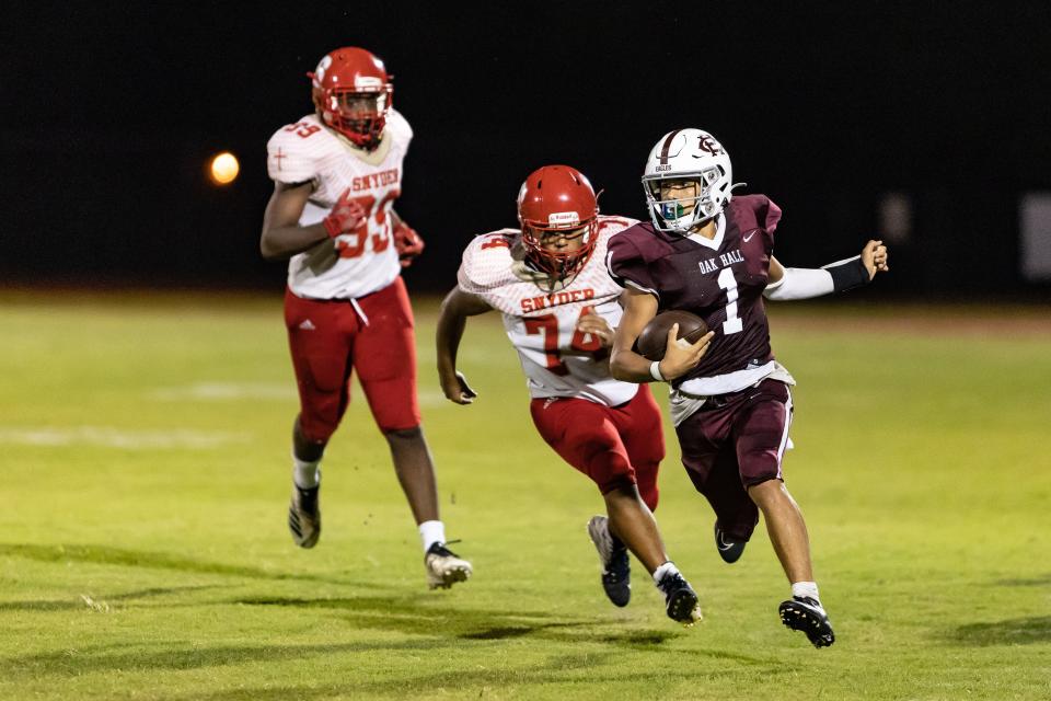 Oak Hall's Dakota Brower (1) with a quarterback carry against Bishop Snyder at Oak Hall School in Gainesville, on Friday, Sept. 2, 2022.