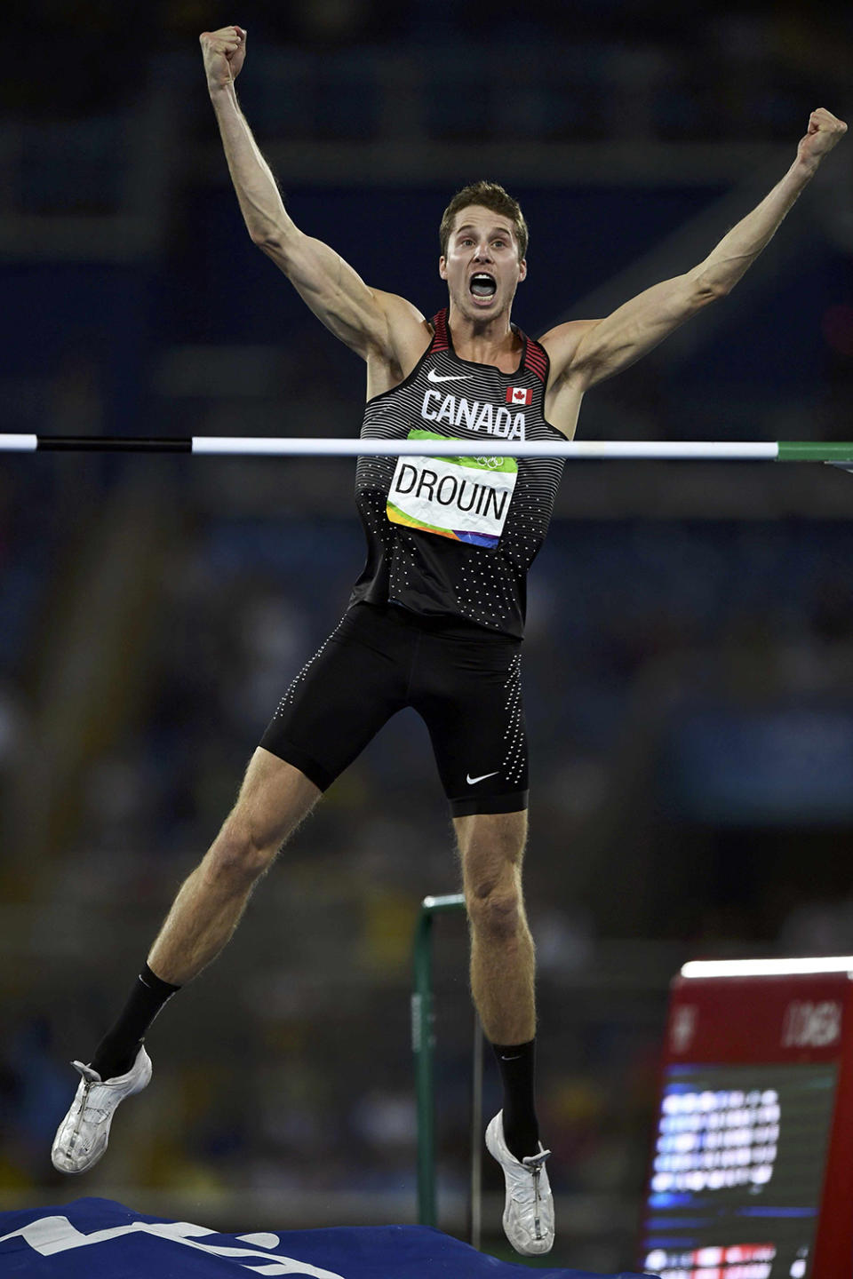 <p>Derek Drouin of Canada celebrates after winning gold in the men’s high jump final at the Olympic Stadium on August 16, 2016. (REUTERS/Dylan Martinez) </p>