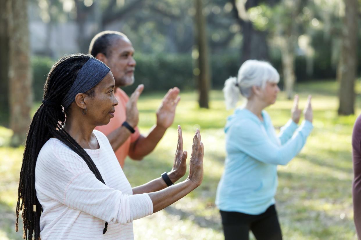 middle-aged folks doing tai chi