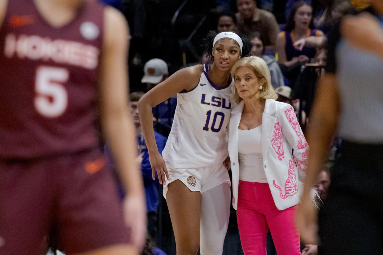 LSU coach Kim Mulkey speaks with forward Angel Reese (10) during the Tigers' game against Virginia Tech on Thursday, Nov. 30, 2023, in Baton Rouge, La.