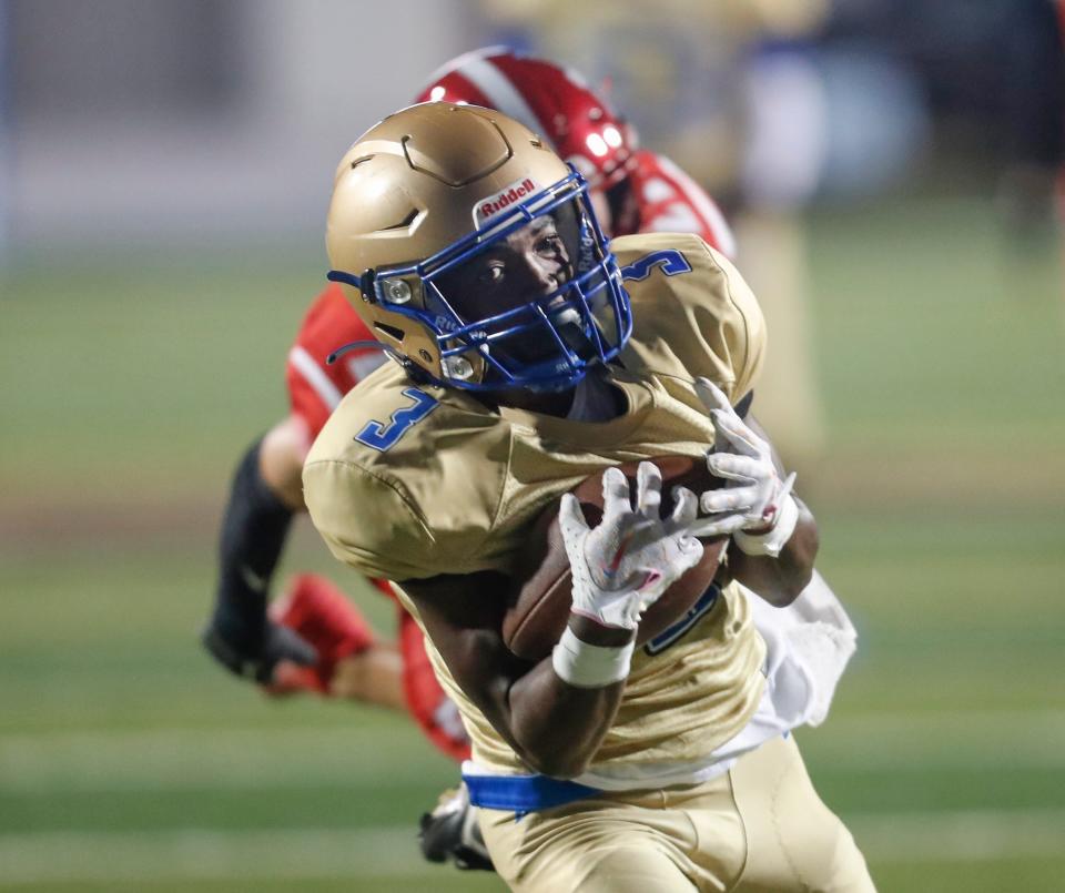 Mainland's Clarence McCloud (3) makes the reception during a game with Seabreeze at Daytona Stadium in Daytona Beach, Friday, Oct. 27, 2023.