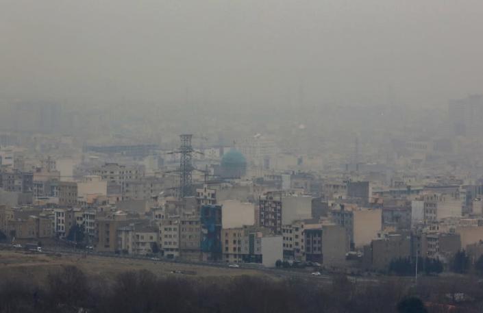 Exhaust fumes from millions of cars and motorcycles that ply Tehran's roads account for 80 percent of its pollution, which increases in winter as emissions fail to rise above cold air (AFP Photo/Atta Kenare)