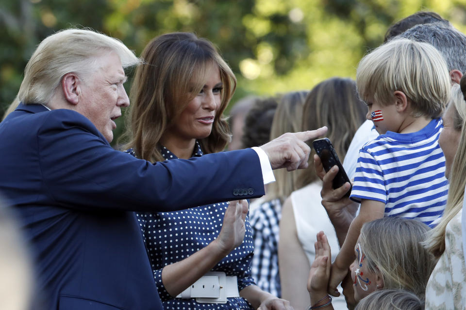 President Donald Trump and first lady Melania Trump greet attendees of the annual Congressional Picnic on the South Lawn of the White House, Friday, June 21, 2019, in Washington. (AP Photo/Jacquelyn Martin)