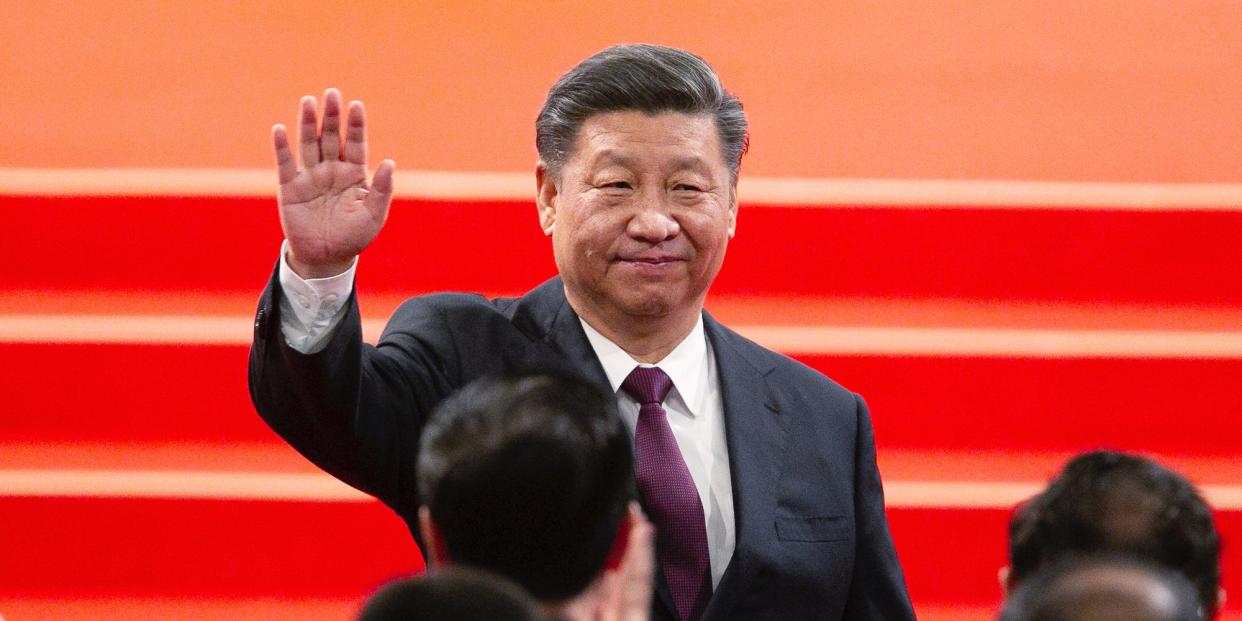 Chinese President Xi Jinping waves during an inauguration ceremony in Macao, in 2019.