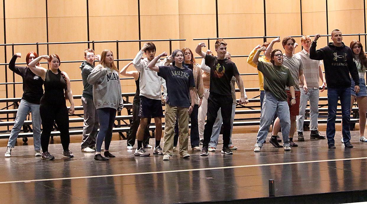 Seniors Rachel Robison, left front, and Owen Radebaugh, center, rehearse with Ashland High School's Sing & Swing for May Fiesta on Tuesday, May 3, 2022.