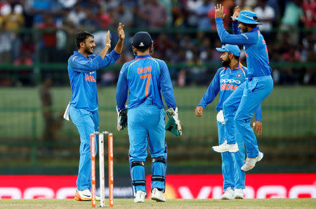Cricket - Sri Lanka v India - Second One Day International Match - Pallekele, Sri Lanka - August 24, 2017 - India's Axar Patel celebrates with his teammates after taking the wicket of Sri Lanka's Angelo Mathews. REUTERS/Dinuka Liyanawatte