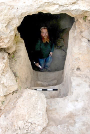 Archaeologist Benyamin Storchan standing at the bottom of the steps in the immersion chamber