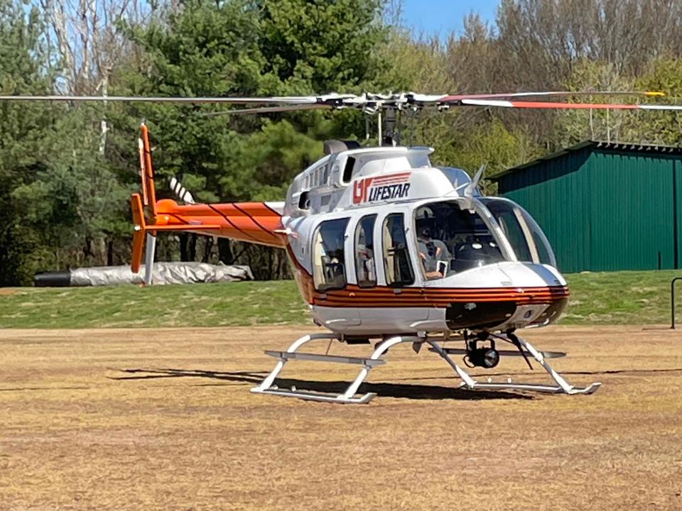 UT LIFESTAR helicopter lands with full crew on board to give tours to the Irish Medicine Club at Knoxville Catholic High School.
