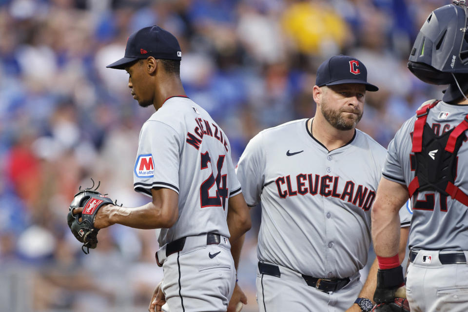 Cleveland Guardians pitcher Triston McKenzie (24) walks past manager Stephen Vogt, right, after being removed during the third inning of the team's baseball game against the Kansas City Royals in Kansas City, Mo., Friday, June 28, 2024. (AP Photo/Colin E. Braley)