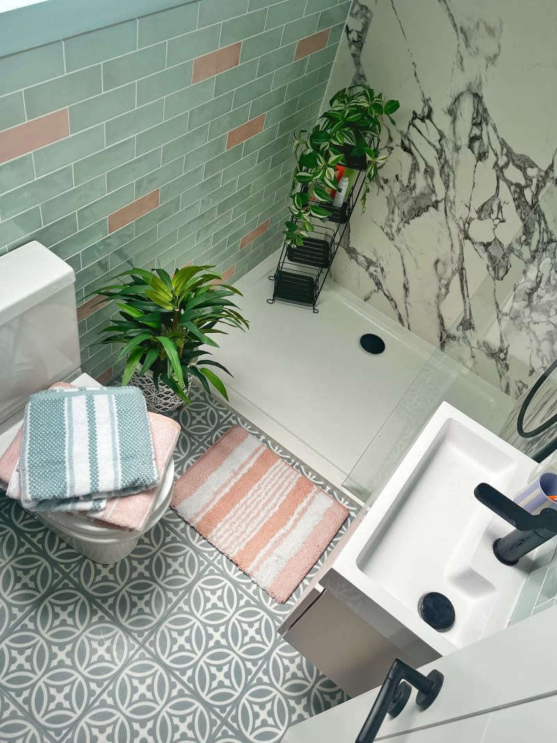 Gray and white patterned tiles in bathroom.