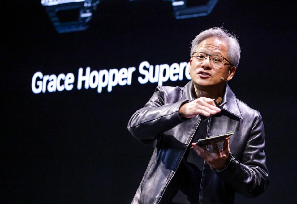 Jensen Huang, co-founder and chief executive officer of Nvidia Corp., speaks during the Taipei Computex expo in Taipei, Taiwan, on Monday, May 29, 2023. In a two-hour presentation in Taiwan, Huang unveiled a new batch of products and services tied to artificial intelligence, looking to capitalize on a frenzy that has made his company the world's most valuable chipmaker.