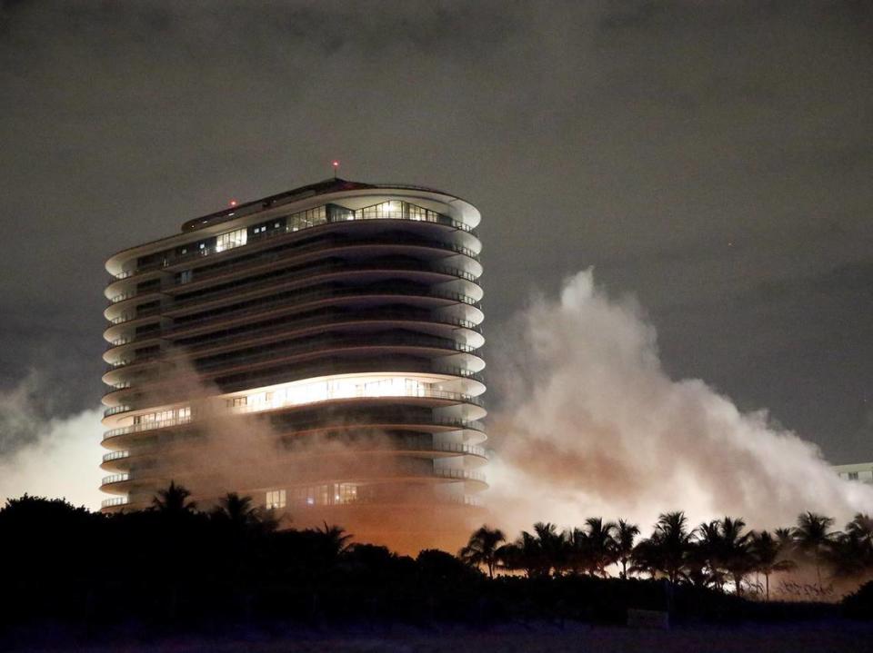 What remained of Champlain Towers South after the June 24 collapse was taken down under a controlled demolition on July 4, 2021. Eighty Seven Park looms in the foreground.